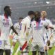 Lyon's Alexandre Lacazette, center right, celebrates with Lyon's Rayan Cherki after scoring a goal during the French League One soccer match between Lyon and Saint-Etienne at the Groupama stadium in Decines, outside Lyon, France, Sunday, Nov. 10, 2024. (AP Photo/Laurent Cipriani)