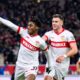 Germany Soccer Bundesliga Stuttgart's scorer Justin Diehl, left, and his teammate Ermedin Demirovic, right, celebrate their side's second goal during the German Bundesliga soccer match between VfB Stuttgart and VfL Bochum in Stuttgart, Germany, Saturday, Nov. 23, 2024. (Tom Weller/dpa via AP)