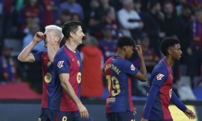 Barcelona's Dani Olmo, left, celebrates with Barcelona's Robert Lewandowski after scoring his side's opening goal during a Spanish La Liga soccer match between Barcelona and Espanyol at the Lluis Companys Olympic Stadium in Barcelona, Spain, Sunday, Nov. 3, 2024. (AP Photo/Joan Monfort)