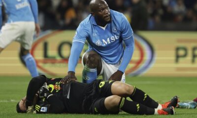 Napoli's Romelu Lukaku tends to Roma goalkeeper Mile Svilar after a challenge during the Italian Serie A soccer match between Napoli and Roma at the Diego Armando Maradona Stadium in Naples, Italy, Sunday Nov. 24 , 2024. (Alessandro Garofalo/LaPresse via AP)