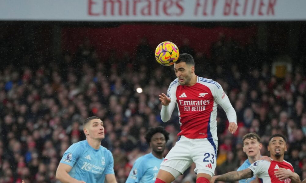 Arsenal's Mikel Merino heads the ball during the English Premier League soccer match between Arsenal and Nottingham Forest at Emirates Stadium in London, Saturday, Nov. 23, 2024. (AP Photo/Kin Cheung)