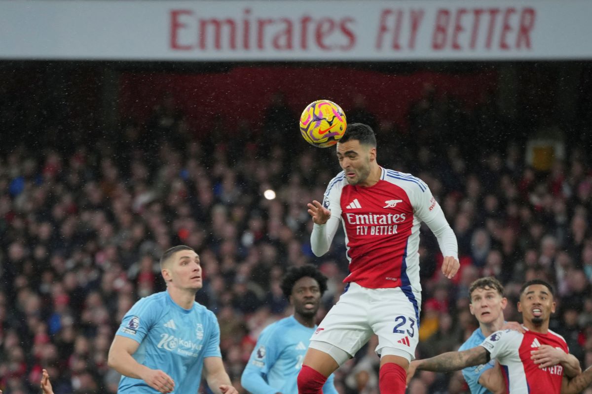 Arsenal's Mikel Merino heads the ball during the English Premier League soccer match between Arsenal and Nottingham Forest at Emirates Stadium in London, Saturday, Nov. 23, 2024. (AP Photo/Kin Cheung)