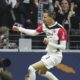 Frankfurt's Hugo Ekitike celebrates scoring their side's first goal of the game during the German Bundesliga soccer match between Eintracht Frankfurt and VfL Bochum at Deutsche Bank Park stadium in Frankfurt, Germany, Saturday Nov. 2, 2024. (Thomas Frey/dpa via AP)