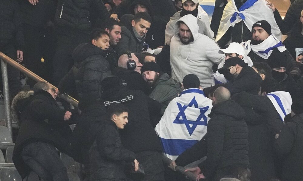 Fans argue on stands during the UEFA Nations League soccer match between France and Israel at the Stade de France stadium in Saint-Denis, outside Paris, Thursday Nov. 14, 2024. (AP Photo/Thibault Camus)