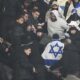 Fans argue on stands during the UEFA Nations League soccer match between France and Israel at the Stade de France stadium in Saint-Denis, outside Paris, Thursday Nov. 14, 2024. (AP Photo/Thibault Camus)