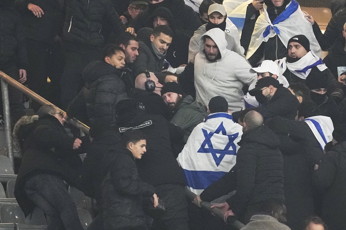 Fans argue on stands during the UEFA Nations League soccer match between France and Israel at the Stade de France stadium in Saint-Denis, outside Paris, Thursday Nov. 14, 2024. (AP Photo/Thibault Camus)