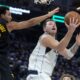 Dallas Mavericks guard Luka Doncic, right, shoots against Golden State Warriors forward Trayce Jackson-Davis during the first half of an Emirates NBA Cup basketball game in San Francisco, Tuesday, Nov. 12, 2024. (AP Photo/Jeff Chiu)