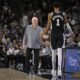 San Antonio Spurs head coach Gregg Popovich, left, greets Spurs forward Victor Wembanyama as he walks off of the court during the first half of an NBA basketball game against the Houston Rockets, Monday, Oct. 28, 2024, in San Antonio. (AP Photo/Darren Abate)