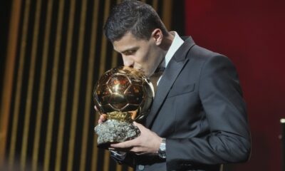 Manchester City's Spanish player Rodri kisses the trophy as he receives the 2024 Men's Ballon d'Or award during the 68th Ballon d'Or (Golden Ball) award ceremony at Theatre du Chatelet in Paris, Monday, Oct. 28, 2024. (AP Photo/Michel Euler)