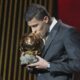 Manchester City's Spanish player Rodri kisses the trophy as he receives the 2024 Men's Ballon d'Or award during the 68th Ballon d'Or (Golden Ball) award ceremony at Theatre du Chatelet in Paris, Monday, Oct. 28, 2024. (AP Photo/Michel Euler)