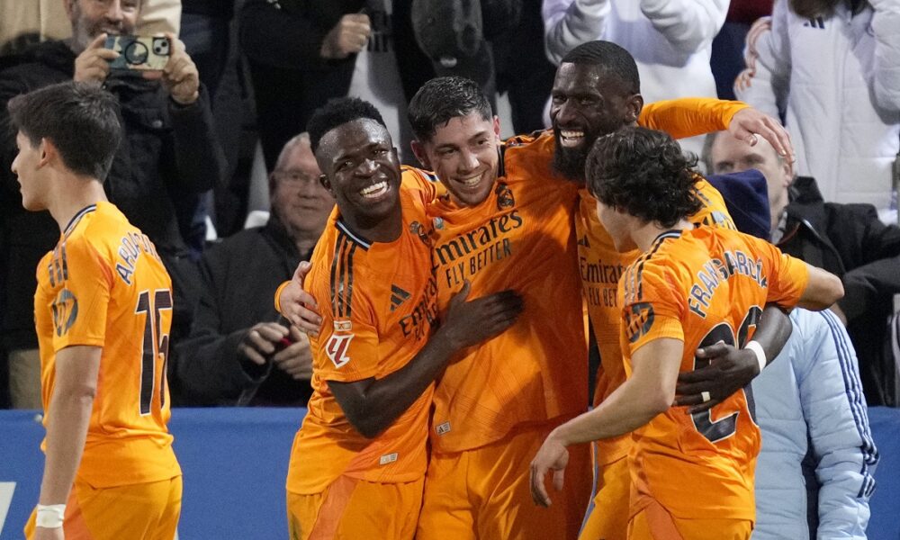 Real Madrid players celebrate after Federico Valverde, 3rd right, scored their second goal during a Spanish La Liga soccer match between CD Leganes and Real Madrid in Leganes, outside Madrid, Sunday, Nov. 24, 2024. (AP Photo/Bernat Armangue)