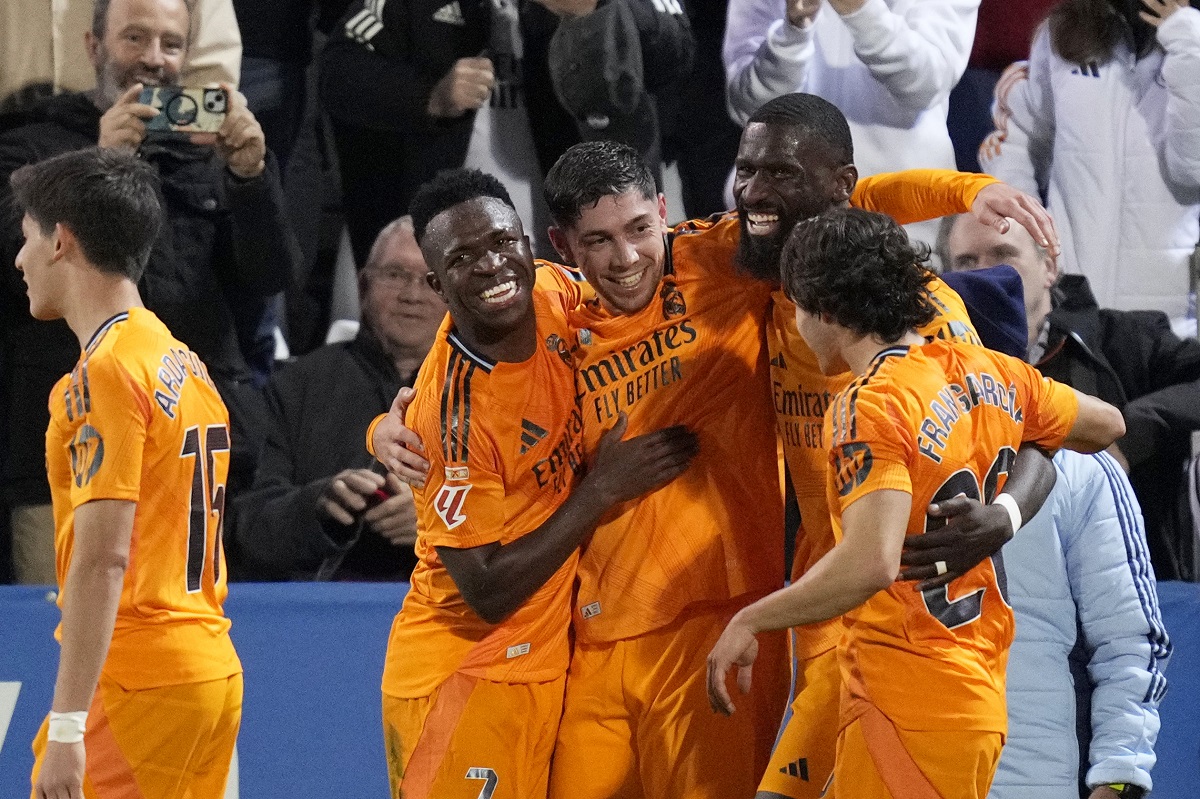 Real Madrid players celebrate after Federico Valverde, 3rd right, scored their second goal during a Spanish La Liga soccer match between CD Leganes and Real Madrid in Leganes, outside Madrid, Sunday, Nov. 24, 2024. (AP Photo/Bernat Armangue)