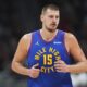 Denver Nuggets center Nikola Jokic turns back to defend after hitting a basket in the second half of an NBA basketball game against the Utah Jazz Saturday, Nov. 2, 2024, in Denver. (AP Photo/David Zalubowski)