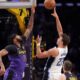 Orlando Magic forward Franz Wagner, right, shoots as Los Angeles Lakers forward Anthony Davis defends during the first half of an NBA basketball game, Thursday, Nov. 21, 2024, in Los Angeles. (AP Photo/Mark J. Terrill)