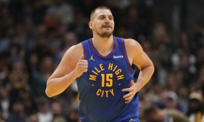 Denver Nuggets center Nikola Jokic smiles after making a basket against the Dallas Mavericks during the first half of an Emirates NBA Cup basketball game Friday, Nov. 22, 2024, in Denver. (AP Photo/Jack Dempsey)