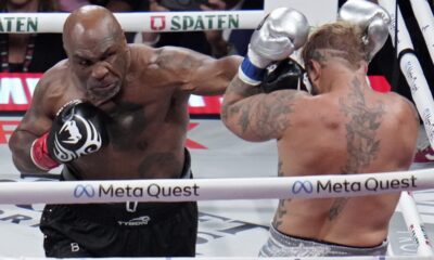 Mike Tyson lands a left to Jake Paul during their heavyweight boxing match, Friday, Nov. 15, 2024, in Arlington, Texas. (AP Photo/Julio Cortez)