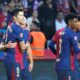 Barcelona's Dani Olmo, second left, celebrates with Barcelona's Robert Lewandowski after scoring his side's opening goal during a Spanish La Liga soccer match between Barcelona and Espanyol at the Lluis Companys Olympic Stadium in Barcelona, Spain, Sunday, Nov. 3, 2024. (AP Photo/Joan Monfort)