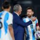 Paraguay's coach Gustavo Alfaro, center, greets Argentina's Lionel Messi during a qualifying soccer match for the FIFA World Cup 2026 in Asuncion, Paraguay, Thursday, Nov. 14, 2024. (AP Photo/Jorge Saenz)