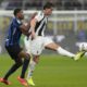 Juventus' Dusan Vlahovic, right, is challenged by Inter Milan's Denzel Dumfries during a Serie A soccer match between Inter Milan and Juventus at the San Siro stadium in Milan, Italy, Sunday, Oct. 27, 2024. (AP Photo/Luca Bruno)