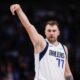 Dallas Mavericks guard Luka Doncic (77) celebrates after a 3-point basket during the first half of an NBA basketball game against the Orlando Magic, Sunday, Nov. 3, 2024, in Dallas. (AP Photo/Gareth Patterson)