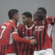 AC Milan's Tijjani Reijnders, center, celebrates with Alvaro Morata, left, and Youssouf Fofana after scoring his side's third goal during the Italian Serie A soccer match between AC Milan and Empoli, at the Milan San Siro stadium, Italy, Saturday, Nov. 30, 2024. (AP Photo/Luca Bruno)