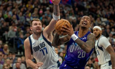 Utah Jazz forward John Collins (20) looks for a shot as Dallas Mavericks guard Luka Doncic (77) defends during the second half of an NBA basketball game Thursday, Nov. 14, 2024, in Salt Lake City. (AP Photo/Rick Egan)