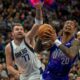 Utah Jazz forward John Collins (20) looks for a shot as Dallas Mavericks guard Luka Doncic (77) defends during the second half of an NBA basketball game Thursday, Nov. 14, 2024, in Salt Lake City. (AP Photo/Rick Egan)