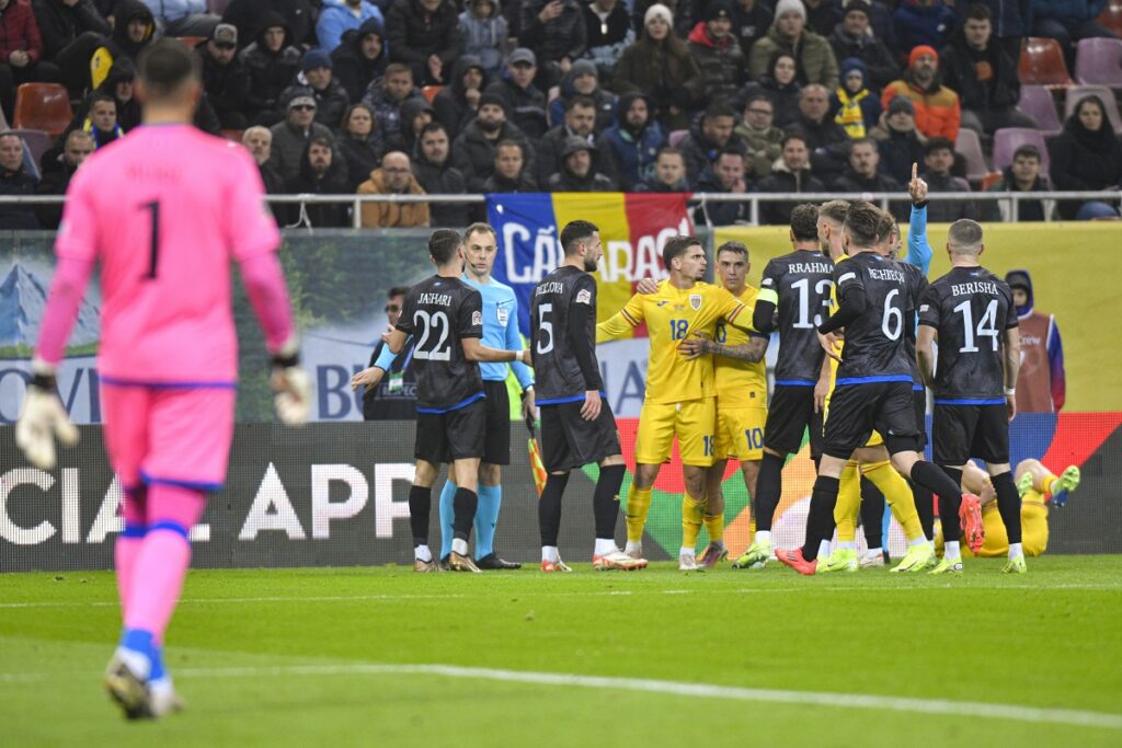 Players scuffle during the UEFA Nations League soccer match between Romania and Kosovo at the National Arena stadium in Bucharest, Romania, Saturday, Nov. 16, 2024. (AP Photo/Alexandru Dobre)