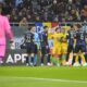 Players scuffle during the UEFA Nations League soccer match between Romania and Kosovo at the National Arena stadium in Bucharest, Romania, Saturday, Nov. 16, 2024. (AP Photo/Alexandru Dobre)