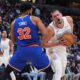 Denver Nuggets center Nikola Jokic, right, drives past New York Knicks center Karl-Anthony Towns (32) in the second half of an NBA basketball game Monday, Nov. 25, 2024, in Denver. (AP Photo/David Zalubowski)