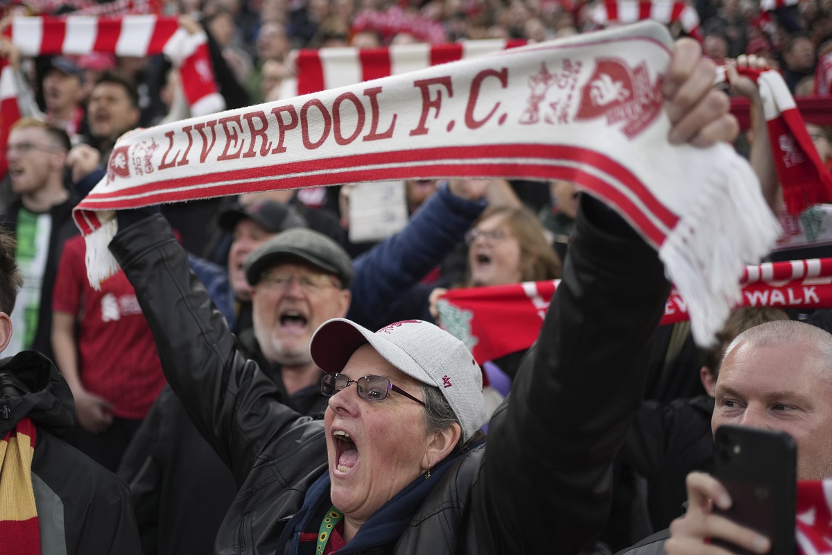 Navijači Liverpula, Liverpool's supporter cheers during the English Premier League soccer match between Liverpool and Brighton at the Anfield stadium in Liverpool, England, Saturday, Nov. 2, 2024. (AP Photo/Jon Super)