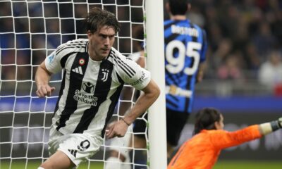 Juventus' Dusan Vlahovic celebrates after scoring his side's opening goal during a Serie A soccer match between Inter Milan and Juventus at the San Siro stadium in Milan, Italy, Sunday, Oct. 27, 2024. (AP Photo/Luca Bruno)