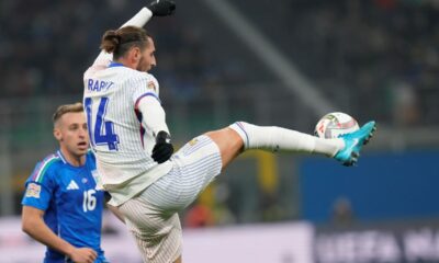 CORRECTS NAMES OF PLAYERS - France's Adrien Rabiot, right, and Italy's Davide Frattesi challenge for the ball during the Nations League soccer match between Italy and France, at the San Siro stadium in Milan, Italy, Sunday, Nov. 17, 2024. (AP Photo/Luca Bruno)