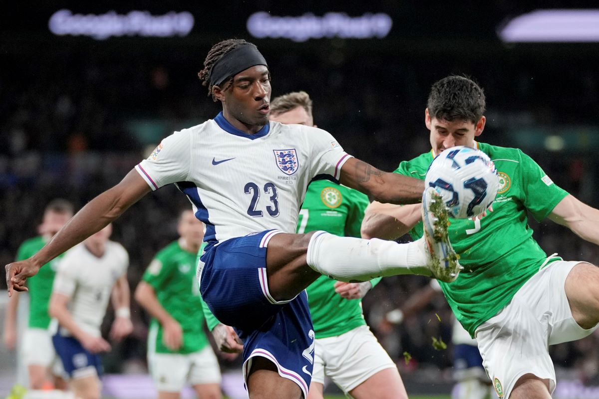 England's Noni Madueke clears the ball away from Ireland's Callum O'Dowda, right, during the UEFA Nations League soccer match between England and the Republic of Ireland at Wembley stadium in London, Sunday, Nov. 17, 2024. (AP Photo/Kin Cheung)