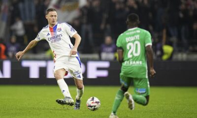 Lyon's Nemanja Matic, left, faces Saint-Etienne's Augustine Boakye during the French League One soccer match between Lyon and Saint-Etienne at the Groupama stadium in Decines, outside Lyon, France, Sunday, Nov. 10, 2024. (AP Photo/Laurent Cipriani)