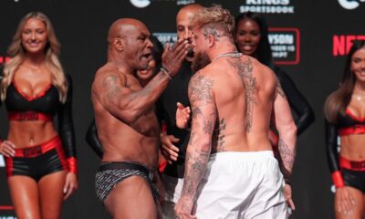 Mike Tyson, left, slaps Jake Paul during a weigh-in ahead of their heavyweight bout, Thursday, Nov. 14, 2024, in Irving, Texas. (AP Photo/Julio Cortez)