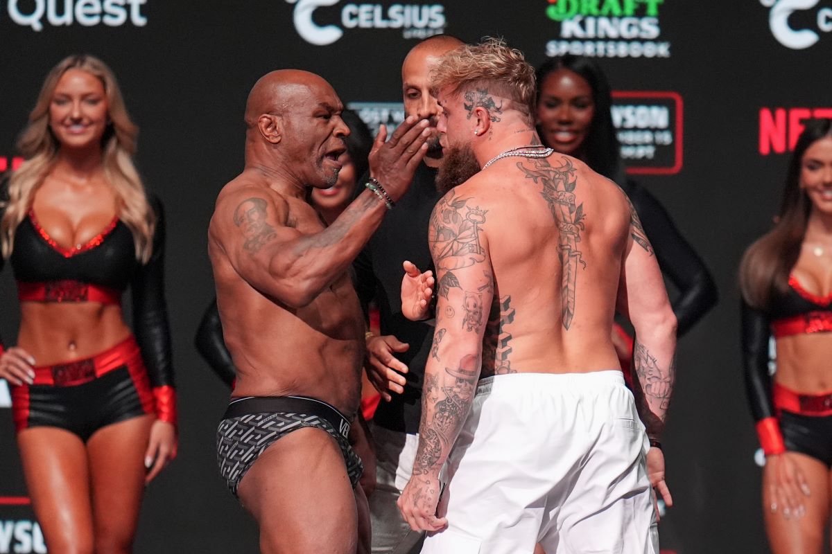 Mike Tyson, left, slaps Jake Paul during a weigh-in ahead of their heavyweight bout, Thursday, Nov. 14, 2024, in Irving, Texas. (AP Photo/Julio Cortez)