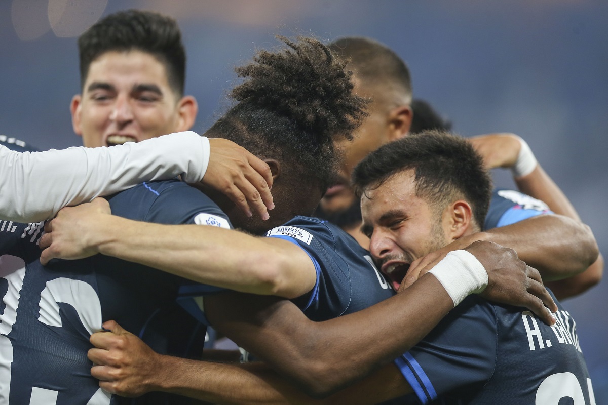 CF Pachuca's Oussama Idrissi celebrates with teammates after scoring the opening goal during the Intercontinental Cup soccer match between Botafogo and CF Pachuca in Doha, Qatar, Wednesday, Dec. 11, 2024. (AP Photo/Hussein Sayed)