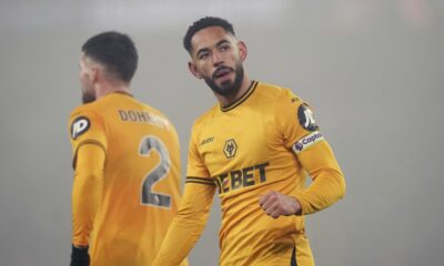 Wolverhampton Wanderers' Matheus Cunha celebrates his sides second goal scored by Hwang Hee-Chan during the English Premier League soccer match between Wolverhampton Wanderers and Manchester United at the Molineux Stadium, Wolverhampton, England, Thursday, Dec. 26, 2024. (David Davies/PA via AP)