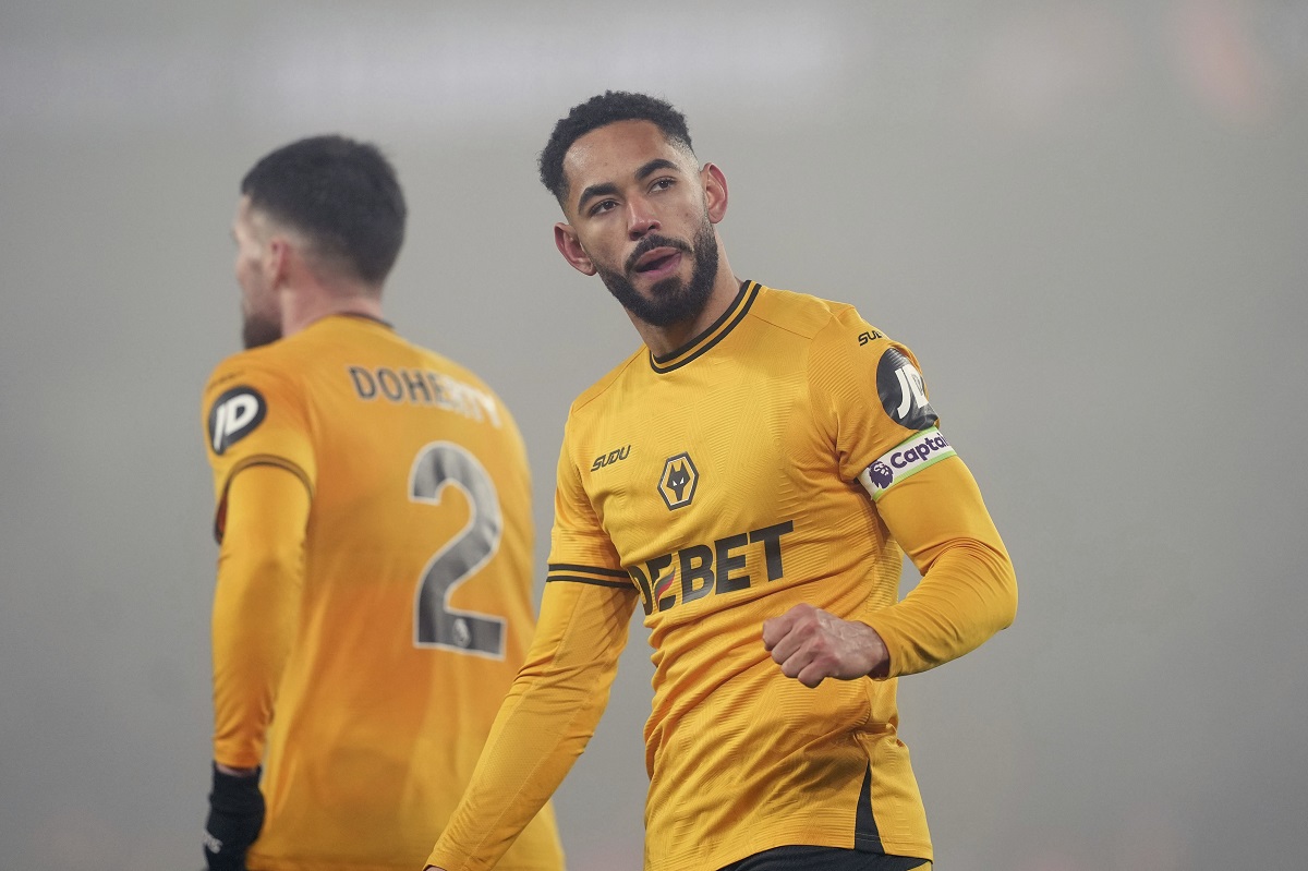 Wolverhampton Wanderers' Matheus Cunha celebrates his sides second goal scored by Hwang Hee-Chan during the English Premier League soccer match between Wolverhampton Wanderers and Manchester United at the Molineux Stadium, Wolverhampton, England, Thursday, Dec. 26, 2024. (David Davies/PA via AP)