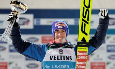 Stefan Kraft, of Austria, poses with his trophy after winning the first stage of the 73rd Four Hills ski jumping tournament in Oberstdorf, Germany, Sunday, Dec. 29, 2024. (AP Photo/Matthias Schrader)