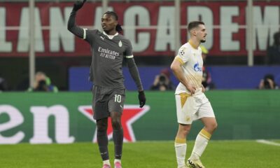 AC Milan's Rafael Leao, left, celebrates after scoring his sides first goal during the Champions League opening phase soccer match between AC Milan and Red Star Belgrade, Crvena Zvezda, at the San Siro stadium in Milan, Italy, Wednesday, Dec. 11, 2024. (AP Photo/Antonio Calanni)