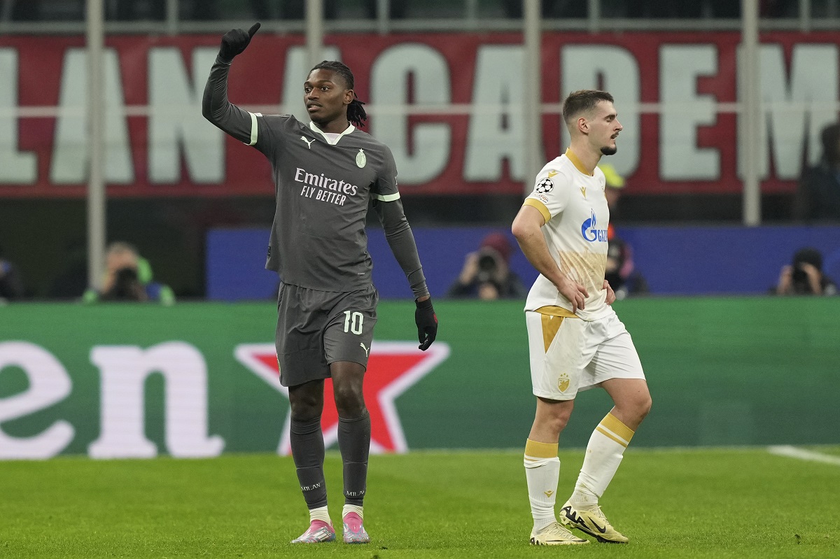 AC Milan's Rafael Leao, left, celebrates after scoring his sides first goal during the Champions League opening phase soccer match between AC Milan and Red Star Belgrade, Crvena Zvezda, at the San Siro stadium in Milan, Italy, Wednesday, Dec. 11, 2024. (AP Photo/Antonio Calanni)