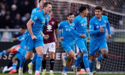 Italy Soccer Serie A Napoli's Scott McTominay, left, celebrates after scoring his side's first goal during the Serie A soccer match between Torino FC and SSC Napoli the Stadio Olimpico Grande Torino in Turin, north west Italy, Sunday, Nov. 24, 2024. (Fabio Ferrari/LaPresse via AP)