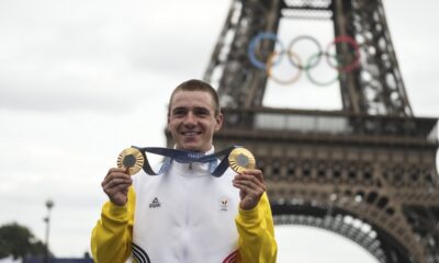 FILE -Remco Evenepoel, of Belgium, shows his gold medals of the men's time trial and road cycling events, at the 2024 Summer Olympics, Saturday, Aug. 3, 2024, in Paris, France. (AP Photo/Thibault Camus, File)