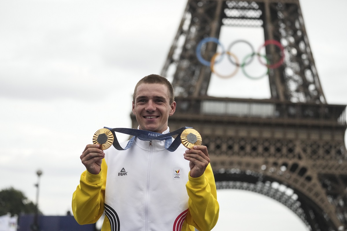 FILE -Remco Evenepoel, of Belgium, shows his gold medals of the men's time trial and road cycling events, at the 2024 Summer Olympics, Saturday, Aug. 3, 2024, in Paris, France. (AP Photo/Thibault Camus, File)