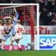 Munich's Konrad Laimer, right, scores during the Bundesliga soccer match between Bayern Munich and RB Leipzig at the Allianz Arena, Munich, Germany, Friday Dec. 20, 2024. (Tom Weller/dpa via AP)