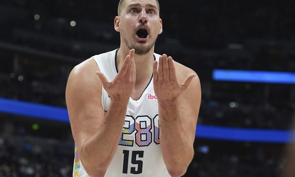 Denver Nuggets center Nikola Jokic reacts after he was called for a foul in the second half of an NBA basketball game against the Phoenix Suns Monday, Dec. 23, 2024, in Denver. (AP Photo/David Zalubowski)