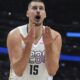 Denver Nuggets center Nikola Jokic reacts after he was called for a foul in the second half of an NBA basketball game against the Phoenix Suns Monday, Dec. 23, 2024, in Denver. (AP Photo/David Zalubowski)