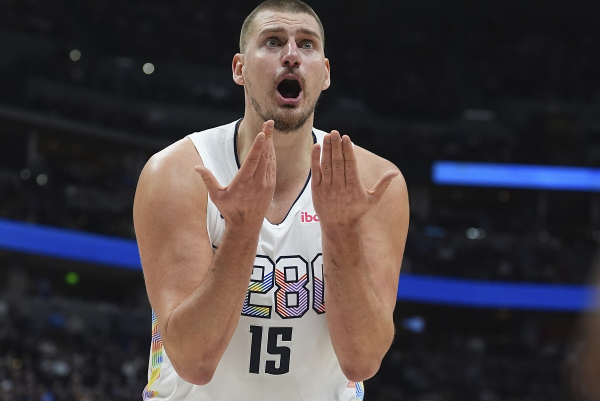 Denver Nuggets center Nikola Jokic reacts after he was called for a foul in the second half of an NBA basketball game against the Phoenix Suns Monday, Dec. 23, 2024, in Denver. (AP Photo/David Zalubowski)